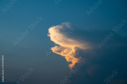 Storm cloud with sunset sky background.Storm before rain.