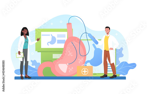 Smiling male and female doctors performing gastroscopy procedure together
