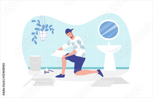 Male expert tiler worker is making floor in toilet at home