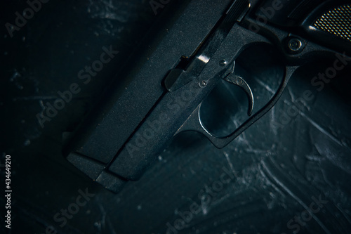 Muzzle of gun close up on green table. Firearm for defense or attack. Pistol for police. Ammunition of law enforcement agencies.