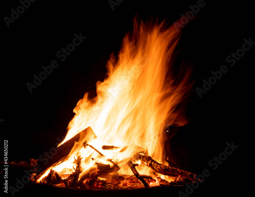 Bonfire on dark background, outdoors setting 