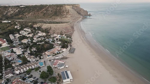 Praia da Luz shore from Rocha Negra headland to beach front. Aerial photo