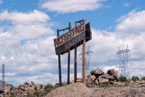 Canvas Print Looking like a scene from a post-apocalyptic movie, the weathered sign merely announces the zero-population non-town of Nothing, AZ