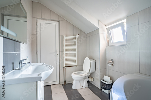 Bathroom bright toilet at home or hotel in day with sink and toilet sit