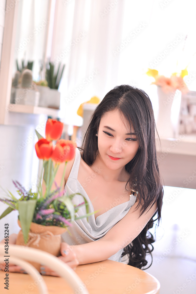 The pretty asian girl is in happy action The pretty asian girl is in happy action