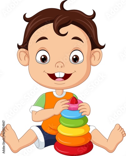 Cartoon little boy playing with colorful pyramid toy