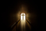 A cross with a light at the end of tunnel