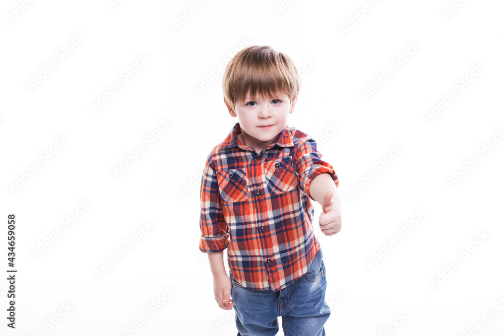 Little boy in plaid shirt thumb up isolated Little boy in plaid shirt thumb up isolated