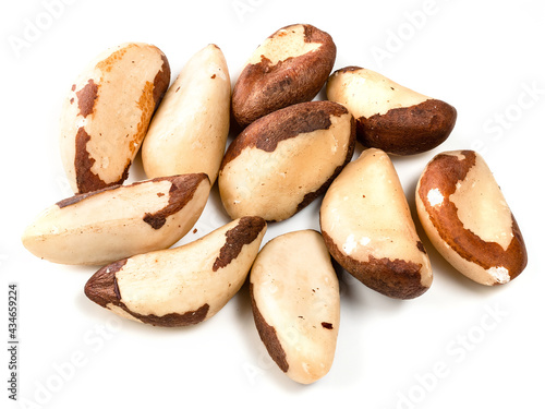 several shelled brazil nuts closeup on white