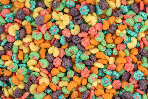 Fruit cereal naturally and artificially fruit flavored sweetened corn puffs. Cereal fruity shapes