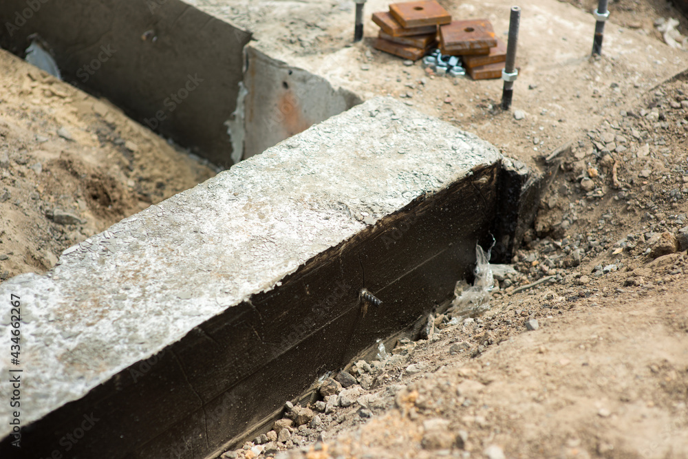 Ready-made concrete foundation for a building on a construction site Ready-made concrete foundation for a building on a construction site