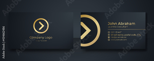 Modern Business Card - Creative and Clean Business Card Template. Luxury business card design template. Elegant dark back background with abstract golden wavy lines shiny. Vector illustration