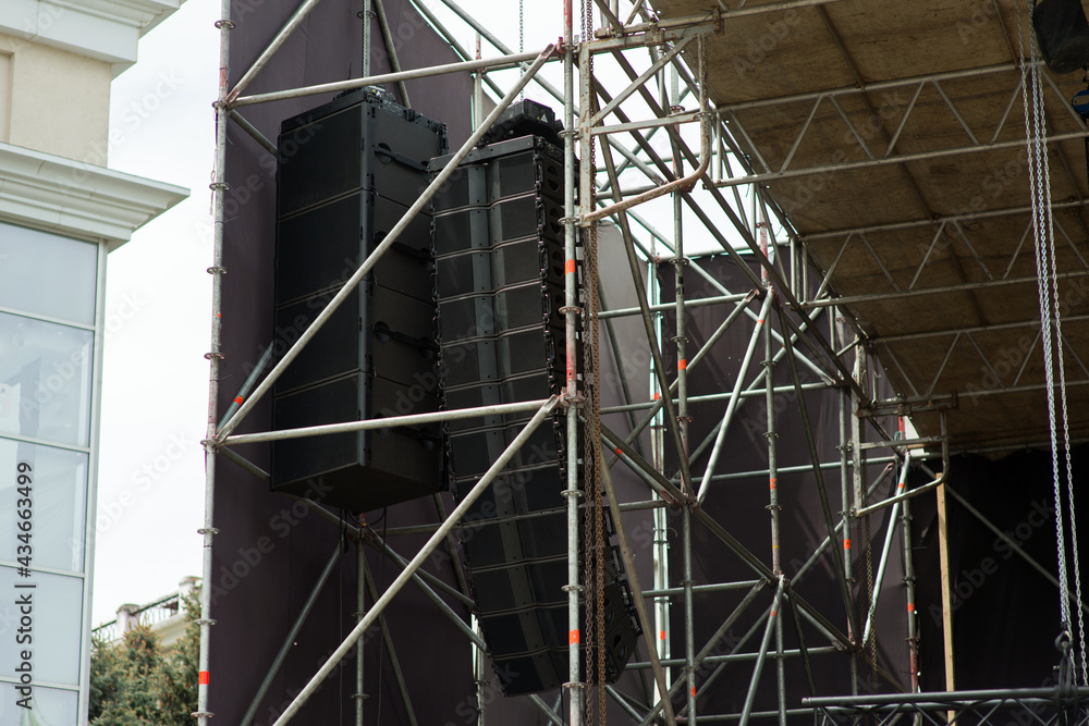 Suspended speakers on a mobile stage
