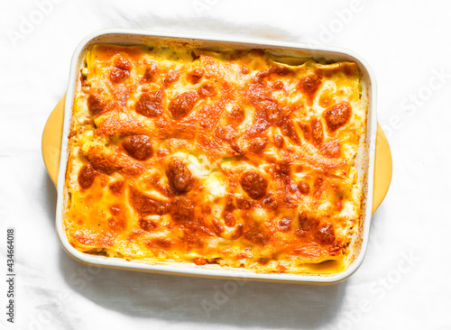 Traditional Italian lasagna on a light background, top view