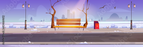 Winter city park with white snow, wooden bench and town buildings on skyline. Vector cartoon snowy landscape of empty public garden with lanterns, bare trees, trash bin and birds in sky