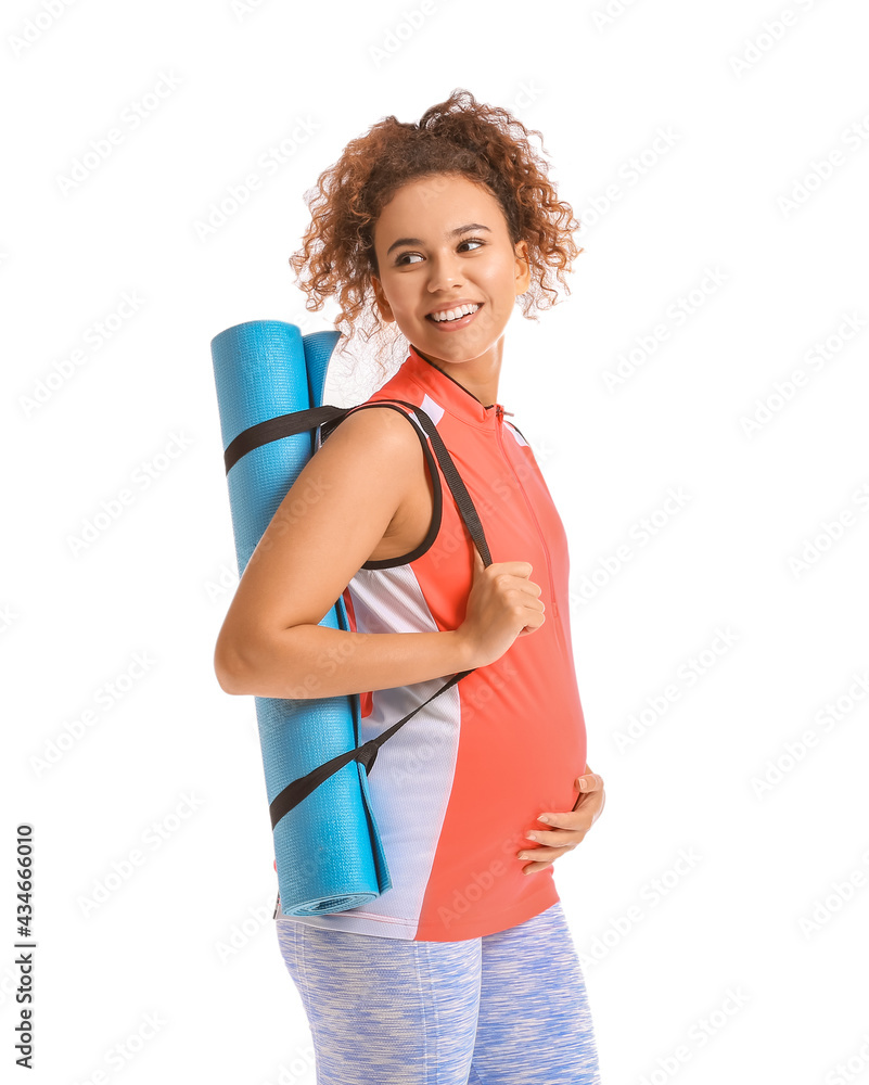 Pregnant African-American woman with yoga mat on white background Pregnant African-American woman with yoga mat on white background