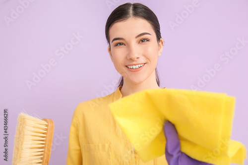 Smiling young woman holding...