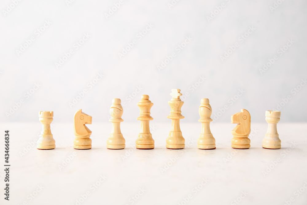 Chess pieces on white background Chess pieces on white background