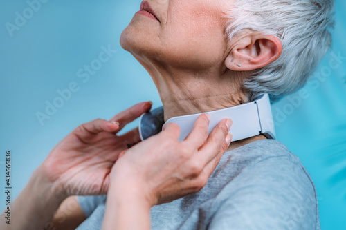Neck massager. Senior Woman Getting a Neck Massage with Massager.