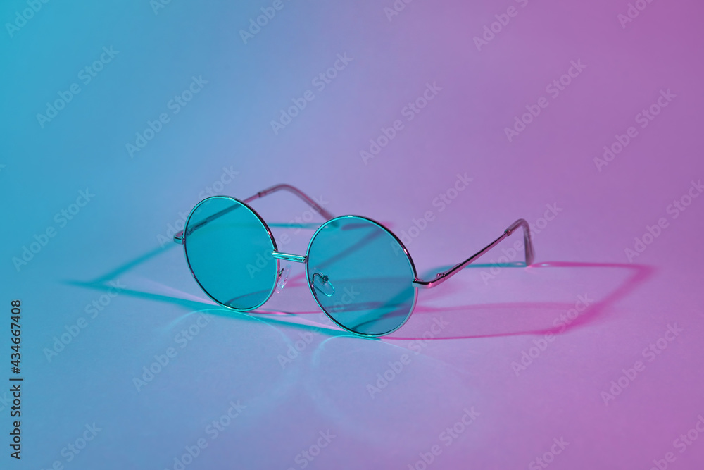 Stylish sunglasses on color background Stylish sunglasses on color background