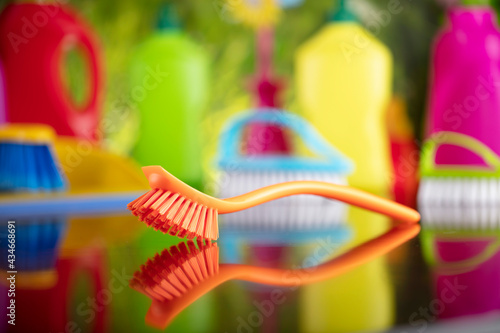 Spring house and office cleaning. Cleaning kit and sources on the glass table. Bokeh  background.