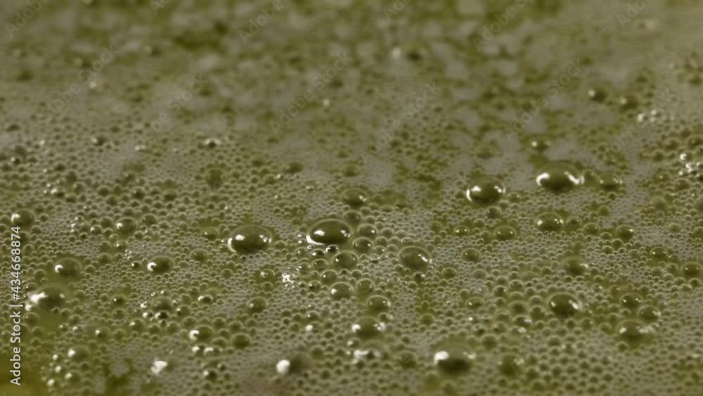 macro video of boiling butter. boiling oil close up. The butter melts in the pan. Cooking desserts. Recipe. Close-up. macro video of boiling butter. boiling oil close up. The butter melts in the pan. Cooking desserts. Recipe. Close-up.