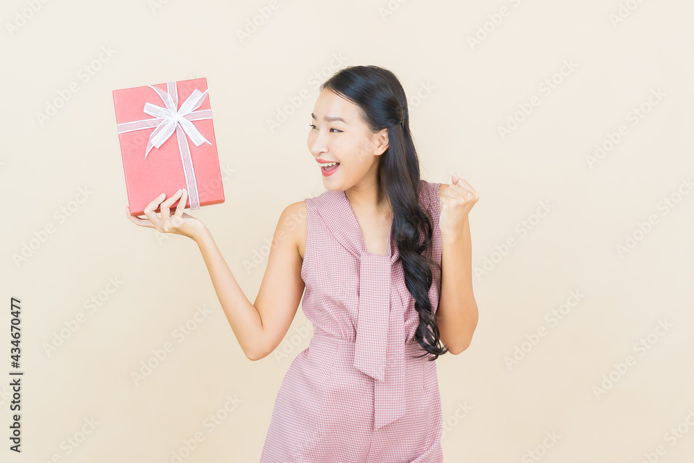 Portrait beautiful young asian woman smile with red gift box Portrait beautiful young asian woman smile with red gift box