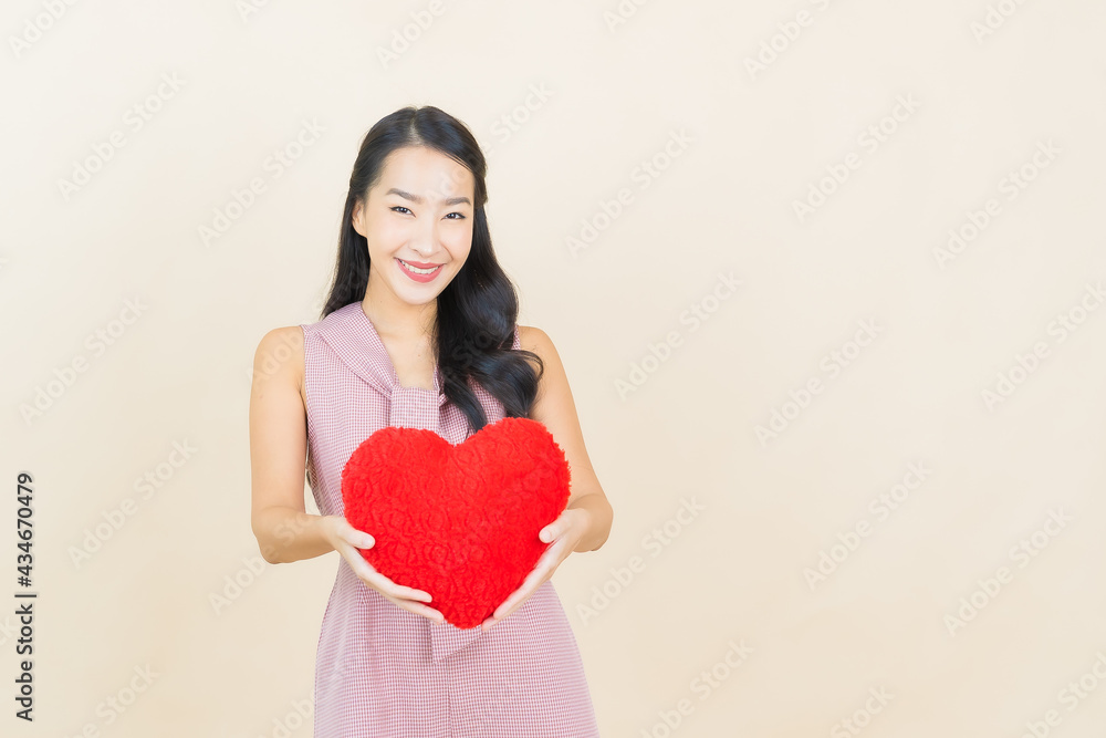Portrait beautiful young asian woman smile with heart pillow shape Portrait beautiful young asian woman smile with heart pillow shape