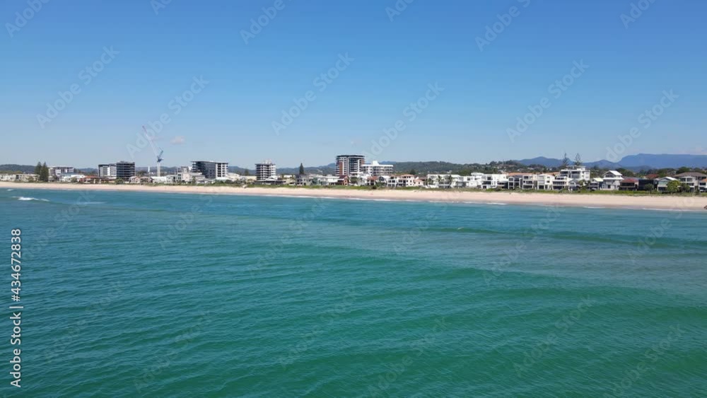 Calm Blue Sea With Coastal Suburb Of Palm Beach In Background - Gold Coast, QLD, Australia. - aerial Calm Blue Sea With Coastal Suburb Of Palm Beach In Background - Gold Coast, QLD, Australia. - aerial