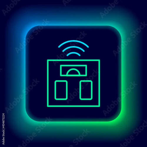 Glowing neon line Smart bathroom scales icon isolated on black background. Weight measure equipment. Internet of things concept with wireless connection. Colorful outline concept. Vector