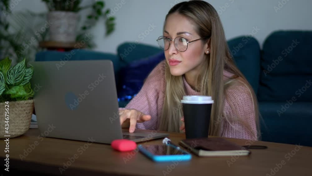 Caucaisan female copywriter making notes of content ideas using laptop computer for working remotely in home, millennial woman in optical spectacles for provide eyes protection typing text Caucaisan female copywriter making notes of content ideas using laptop computer for working remotely in home, millennial woman in optical spectacles for provide eyes protection typing text