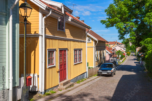 Idyllic city street with old wooden houses