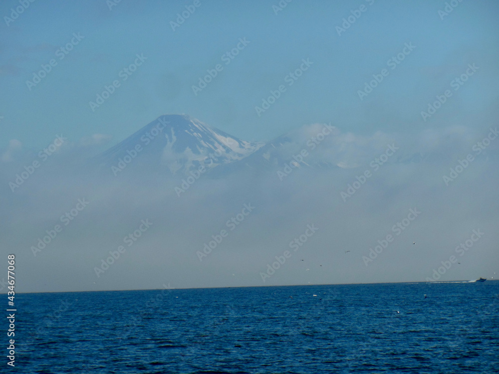 Volcano due to clouds from the sea