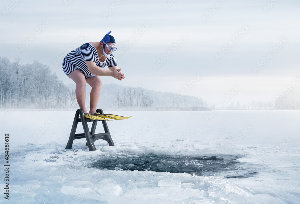 Fuunny overweight, retro swimmer about to jump into ice hole in the lake, with copy space - obrazy, fototapety, plakaty 