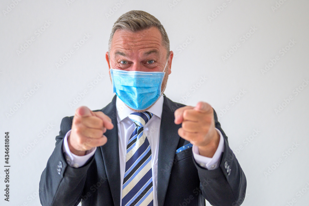 Businessman pointing fingers on both hands at the camera Businessman pointing fingers on both hands at the camera