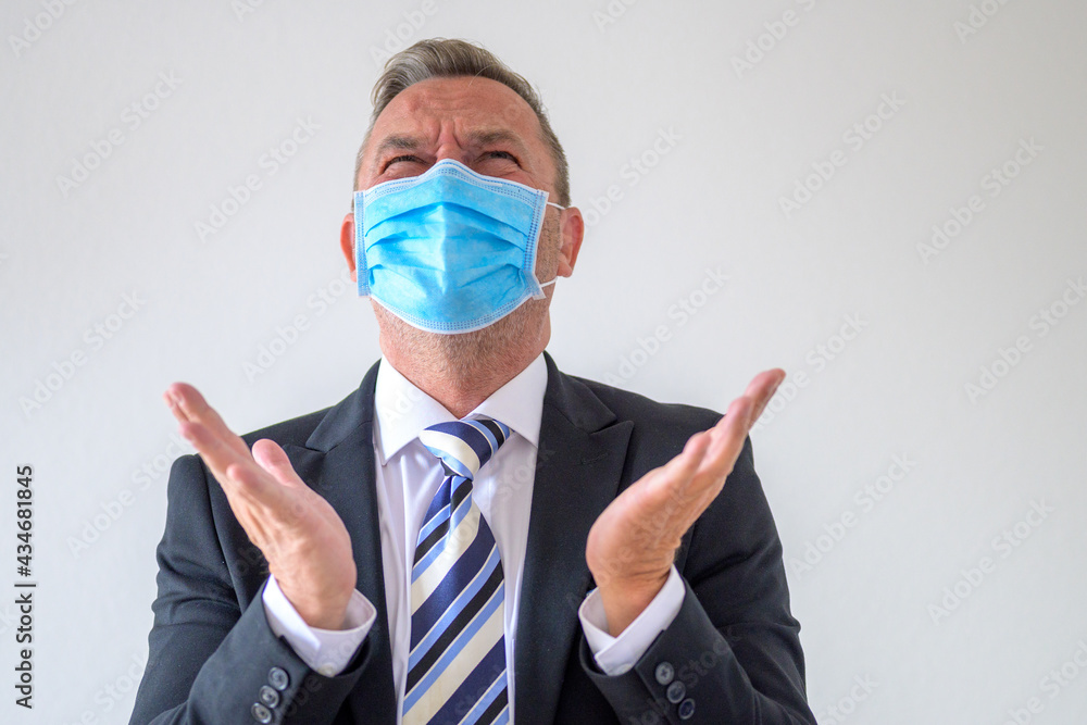 Anguished man throwing up his hands and screwing up his eyes Anguished man throwing up his hands and screwing up his eyes