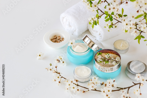 Cosmetic cream in a glass container and serum capsules. Natural spa cosmetics. copy space