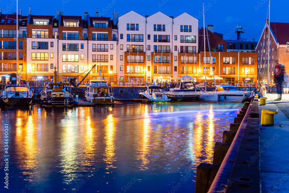 Night view on new residential and apartment buildings build in a harbour