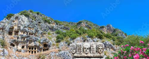 Ancient tombs by Lycians in Fethiye, Turkey photo