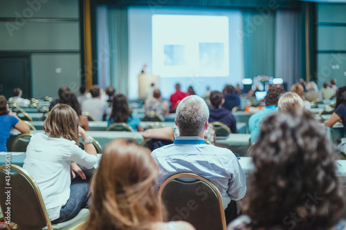 Audience in lecture hall on scientific conference.