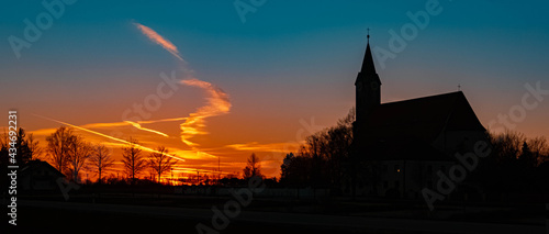 Beautiful sunset with a church silhouette near Kurzenisarhofen, Bavaria, Germany © Martin Erdniss