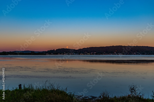 Nearly a full moon  sunset waterscape