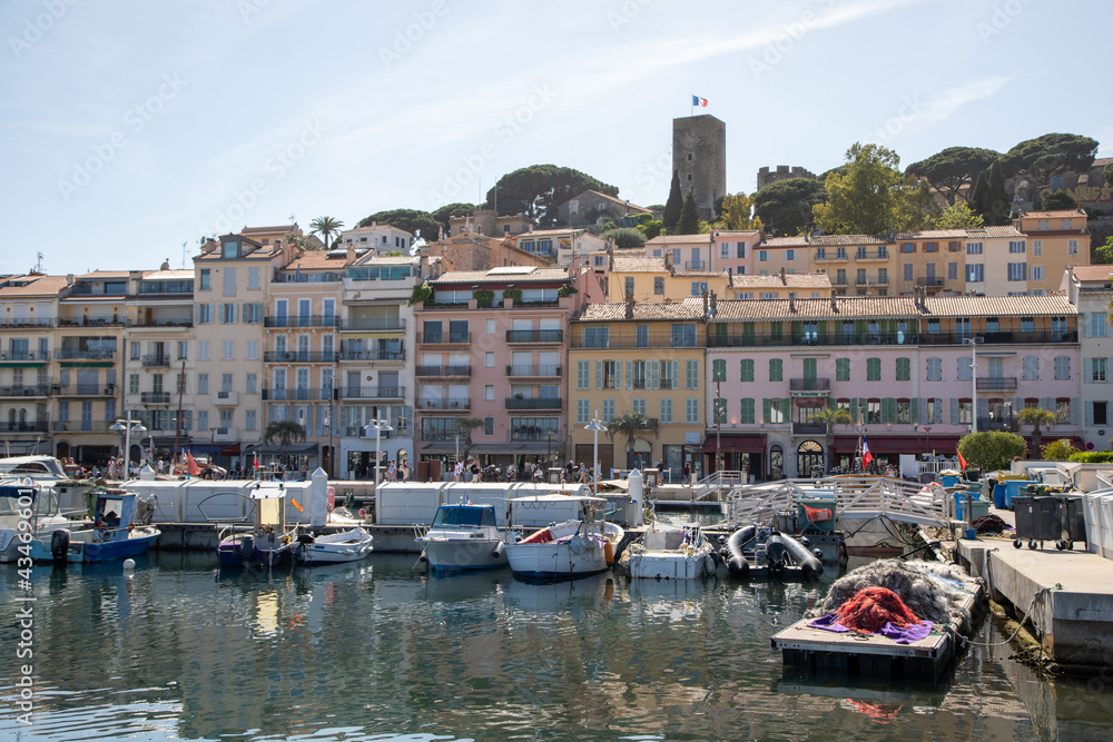 The fishing port in Cannes on the French riviera looking towards the La Castre castle