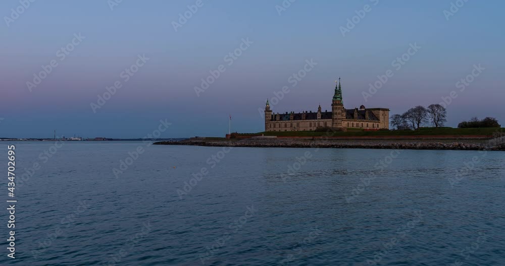 Sunset and moonrise at Kronborg Castle in Helsingør, Denmark Sunset and moonrise at Kronborg Castle in Helsingør, Denmark
