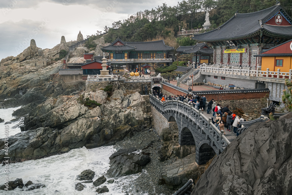 Beautiful scenery of the temple and many people who visit Haedong Yonggungsa Temple in Busan, South Korea.