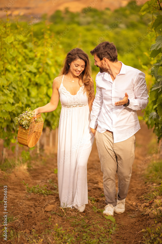 Couple standing and talking in vineyard. Couple standing and talking in vineyard.
