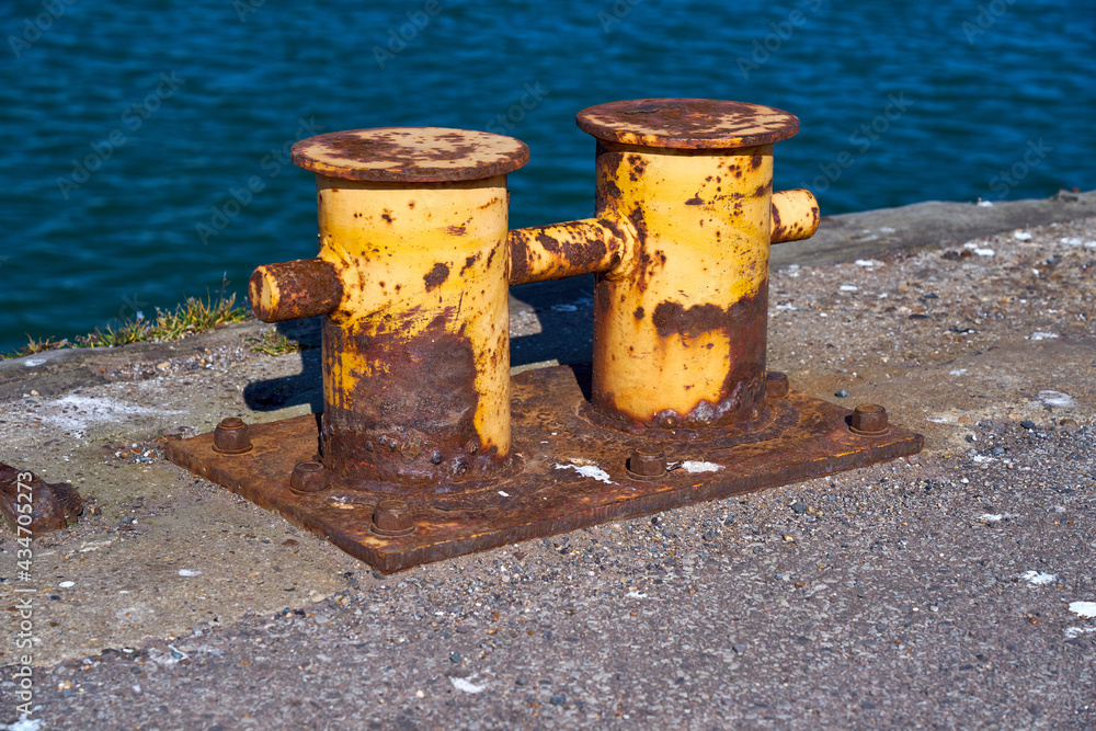 A side view of a double bitt mooring bollard