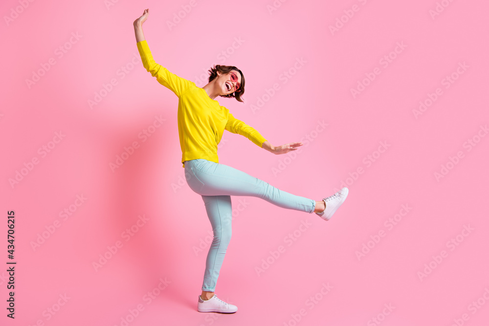 Full size photo of young attractive happy excited cheerful positive girl dancing enjoy weekend isolated on pink color background Full size photo of young attractive happy excited cheerful positive girl dancing enjoy weekend isolated on pink color background