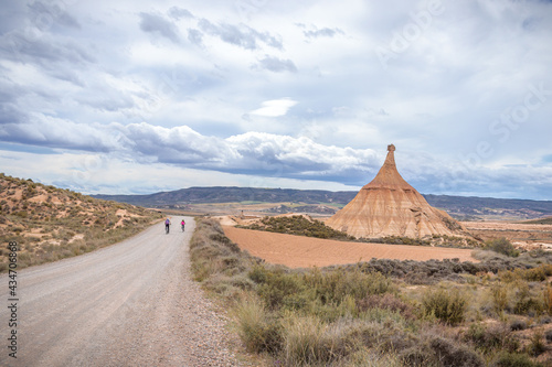 Fotografie Bicycle path next to Castildetierra Mountain in Badlans of Navarre (Bardenas Reales de Navarra) dessert in the middle of Spain