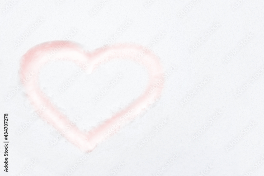 Red heart shape drawing on white snow as love valentine background